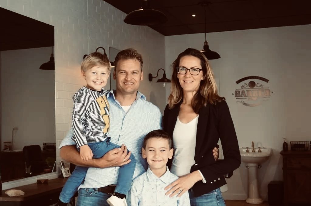 Family visiting Lee Colton Barber Shop