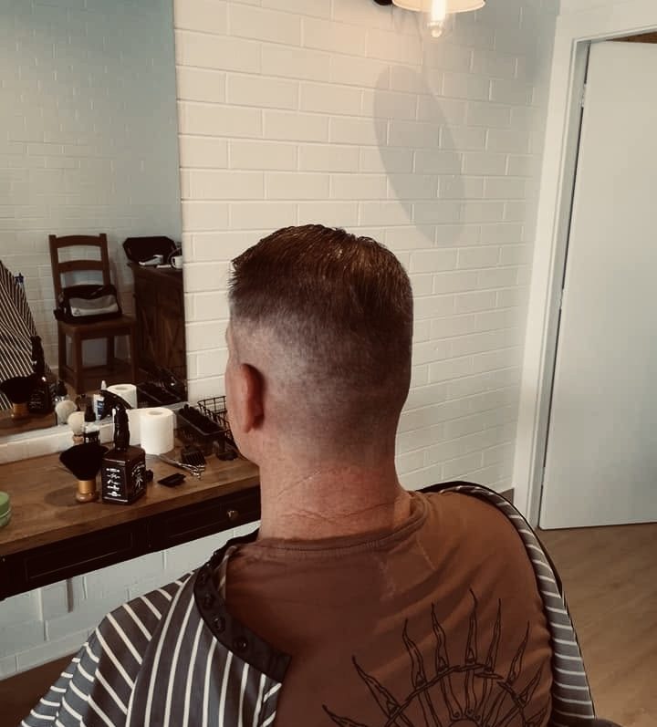 Clean skin fade haircut, back view