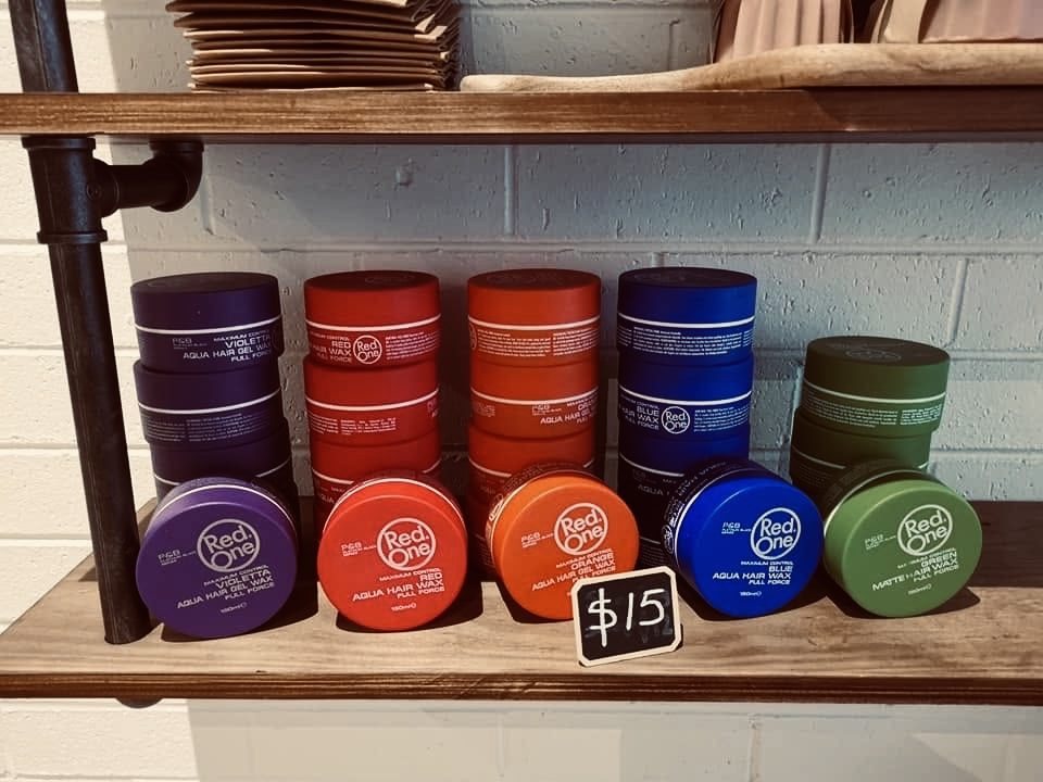 Red One hair wax display, $15 each